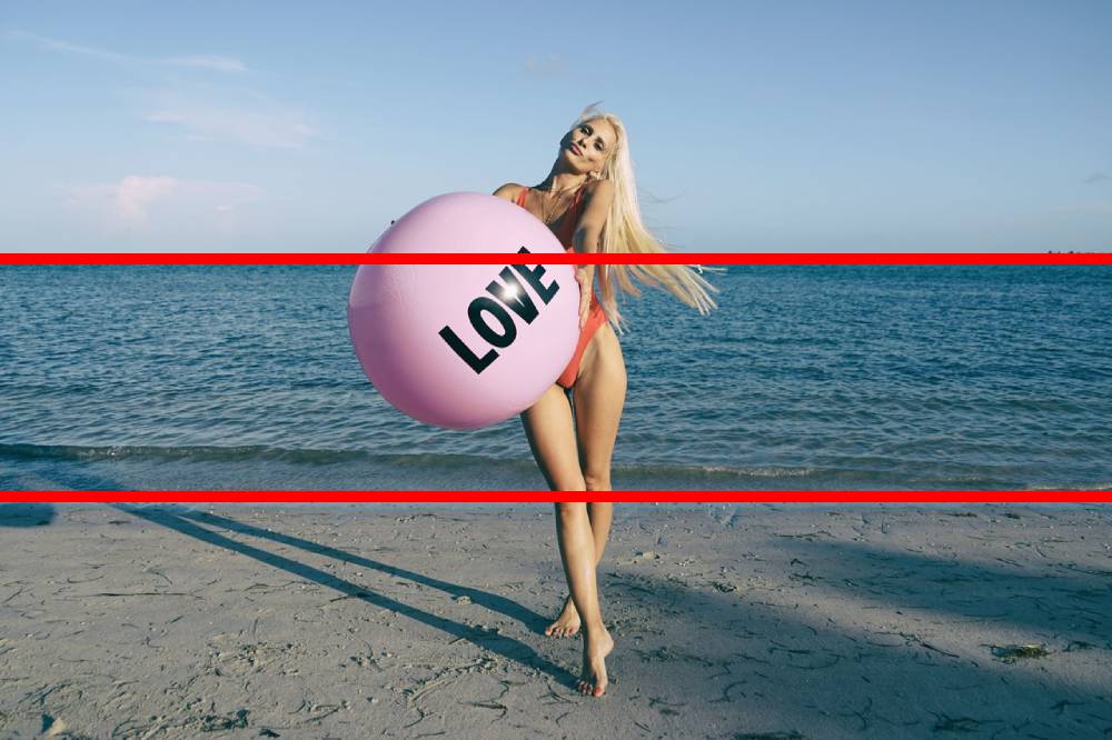 Photograph of woman on beach with rule of thirds shown